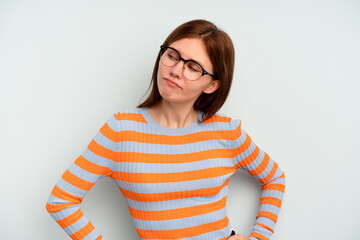 Young English woman isolated on blue background dreaming of achieving goals and purposes