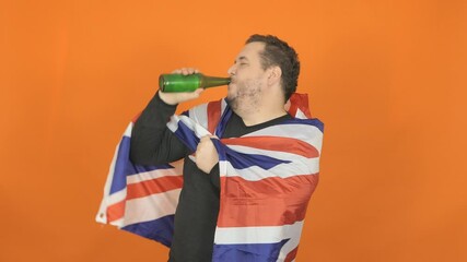 Fat man wrapped in the flag of America drinks beer. - Powered by Adobe