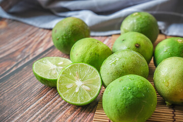 Fresh lime fruit with slices of lime