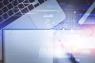Obraz premium Multi exposure of data theme drawing hologram over topview work desk background with computer. Concept of technology.