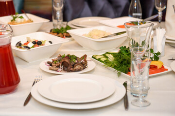 Cold snacks on the festive table. A table with food served with dishes for guests.