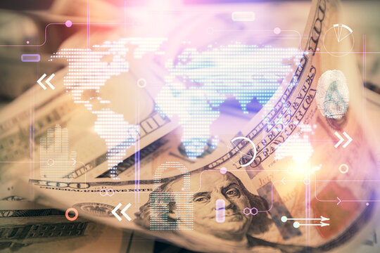 Double exposure of world map drawing over us dollars bill background. International concept.