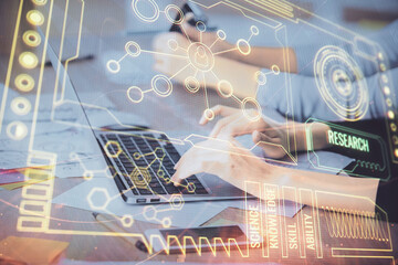 Multi exposure of woman hands working on computer and data theme hologram drawing. Tech concept.