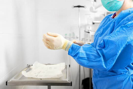 Female Medical Worker Wear Protective Suit And Ready To Take Care Of Coronavirus Patient In Isolation Room. High Quality Photo