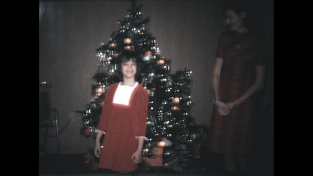 Christmas Clothes 1972 - A woman and her daughter model their Christmas attire before the family Christmas tree in Vernon Township, New Jersey in 1972. 