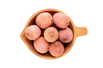 Three ripe sweet Litchi fruits in a wooden cup, isolated on white, close-up, top view.