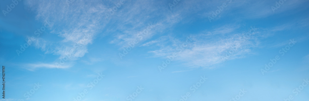Wall mural wide blue sky with fluffy cirrus clouds