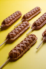 waffles sticks plains on yellow background. making patterns