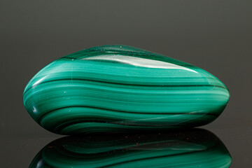 macro mineral stone malachite on a black background