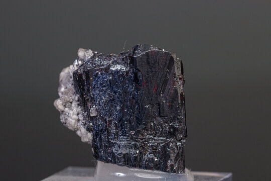 macro mineral Acanthite stone on a black background