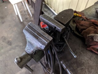 old vice in the garage closeup photo.