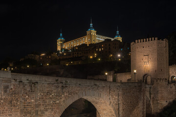 View of Alcantara Bridge and the Alcazar of Toledo by the night - Toledo Spain - obrazy, fototapety, plakaty