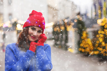 Charming lady spending winter holidays at the street market