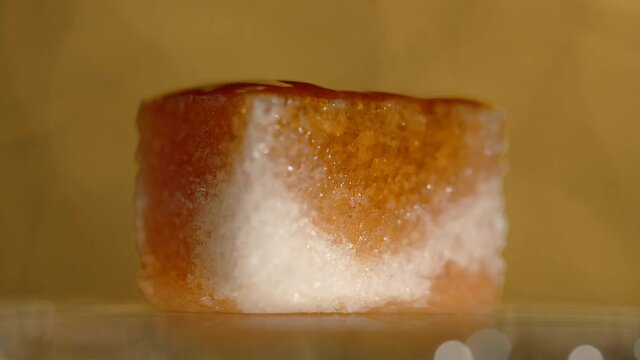 Drops of bitter falls to the lump shugar in slow motion, making of the old fashioned, Full HD 240 fps Prores HQ