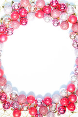 Christmas pink background with balls and place for an inscription
