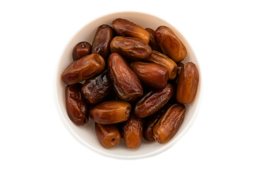 Dates on a white plate on a white background. Date isolate