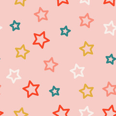 Obraz premium seamless pattern childish doodle drawing stars on pink background. cute colored stars in pastel colors. kids cartoon background for textile, wallpaper, wrapping paper