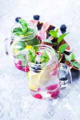Fresh figs with mint leaves and blackberry. Flat lay, Copy space. Vegetarian food. Healthy diet.