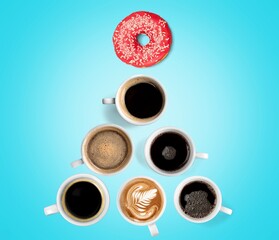 Cups with hot drinks, coffee, cappuccino, coffee with milk, Christmas tree shape, blue background.