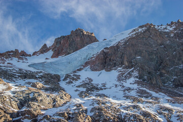 Huge blue glacier in the snowy mountains. Kazakhstan, near city of Almaty.