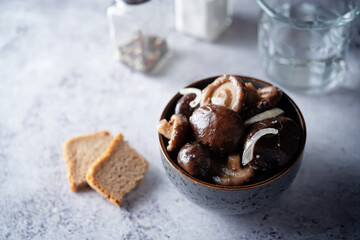 Gruzdi mushrooms with pickled onion and garlic.