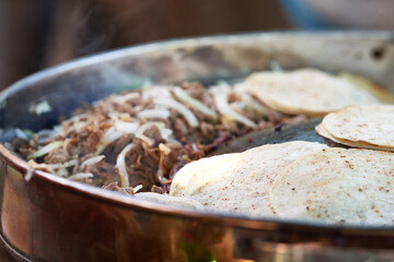 Beef tacos with onion, cilantro and salsa. Street tacos. Mexican tacos. Street sale of tacos.