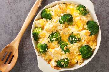 Broccoli Chicken divan is a creamy casserole topped with crispy buttered breadcrumbs close up in...