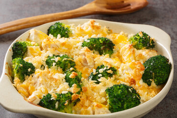Chicken Divan is a type of chicken and broccoli casserole with a creamy sauce close up in the dish...