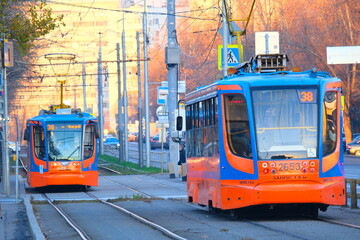 Fototapeta premium Tram, train, electric train, railway. Ecological transport. Urban infrastructure.