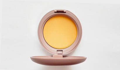 Compact powder for natural color make-up close-up isolated on a white background