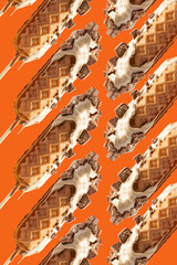waffle sticks patterns. glazed with white chocolate al chocolate wafer . orange background