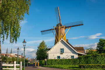 Historical dutch windmill in the city of Etten-Leur, Province North Brabant, on a sunny summer day