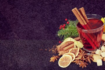 Christmas or New Year hot winter drink, spicy grog cocktail, punch or mulled wine with tea,