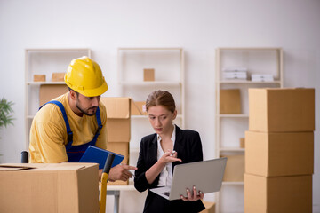 Young female boss and male contractor doing home relocation