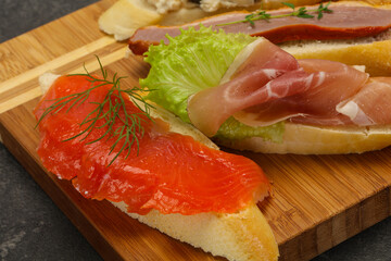 Tapas - bruschetta with prosciutto, salmon, duck and gorgonzola