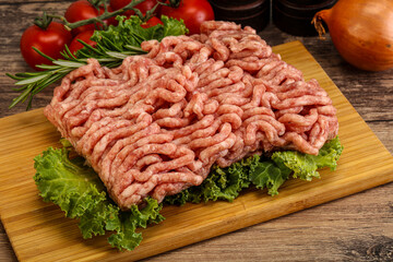 Raw pork minced meat over board