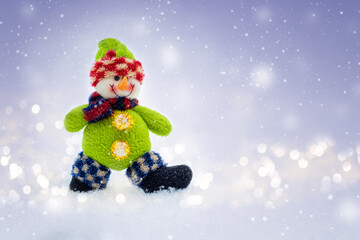 Snowman toy on winter background, Christmas concept