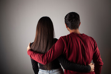 Back view couple in studio