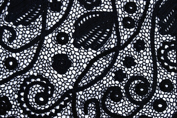 Irish lace seamless pattern. crochet black flowers and leaves from black yarn