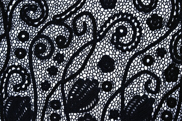 Irish lace seamless pattern. crochet black flowers and leaves from black yarn