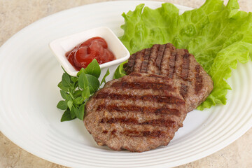Grilled beef burger cutlet with sauce
