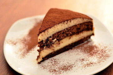 tiramisu plate on wooden table