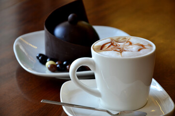 chocolate cake with strawberry and cup of coffee
