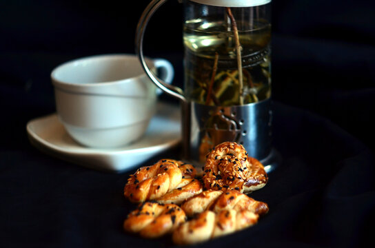 pastry with tea on dark background
