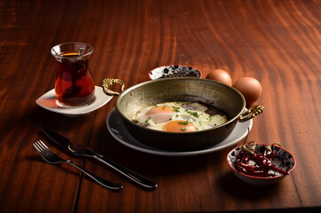 turkish sausage and eggs on wooden table