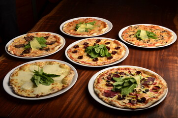 pizza with chesee and sausage on wooden table