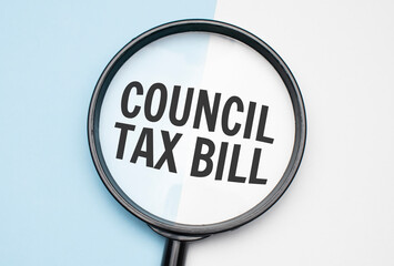 Finance and economics concept. Magnifier on a white backgroundd, inside the text is written coUNCIL TAX BILL