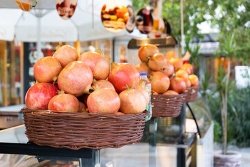 Ripe pomegranates in baskets for making juice on the street in Turkey