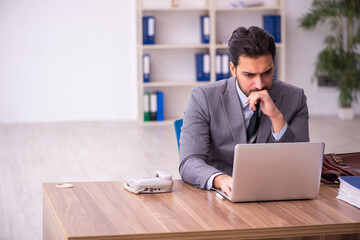 Young businessman employee working in the office