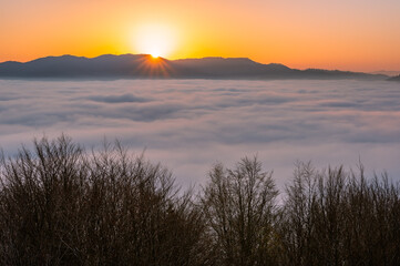 Misty autumn mountains landscape in the morning, Poland, Beskidy mountains, Prehyba peak seen from Koziarz.